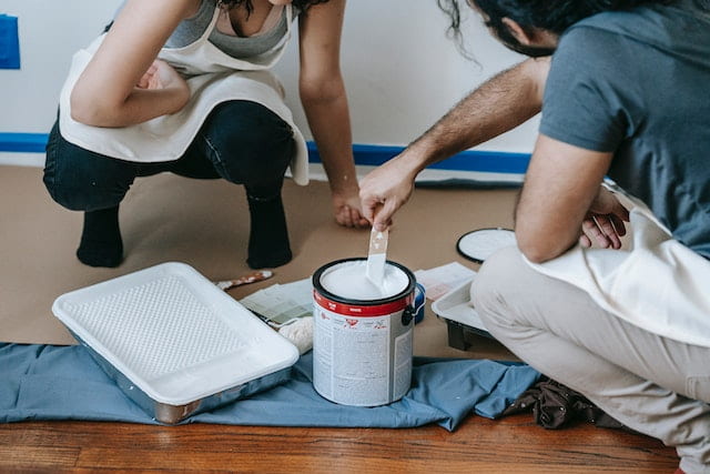 Painters mixing the paint to test the hypothesis can you mix spray paint with regular paint